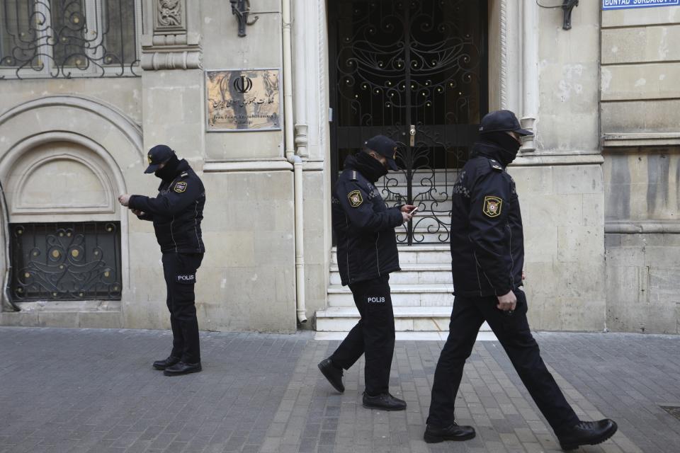 Police officers guard an area in front of the Iranian Embassy in Baku, Azerbaijan, Friday, Jan. 27, 2023. According to Azerbaijan's Foreign Ministry a man armed with a Kalashnikov-style rifle attacked the Azerbaijan Embassy in Iran's capital Tehran, killing the head of security at the diplomatic post and wounding two guards. (AP Photo/Aziz Karimov)