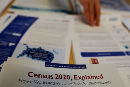 Informational pamphlets are displayed an event for community activists and local government leaders to mark the one-year-out launch of the 2020 Census efforts in Boston, Massachusetts, U.S., April 1, 2019. REUTERS/Brian Snyder