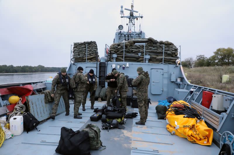 Navy divers from the 12th Minesweeper Squadron of the 8th Coastal Defense Flotilla take part in an operation to defuse the largest unexploded World War Two Tallboy bomb ever found in Poland, in Swinoujscie