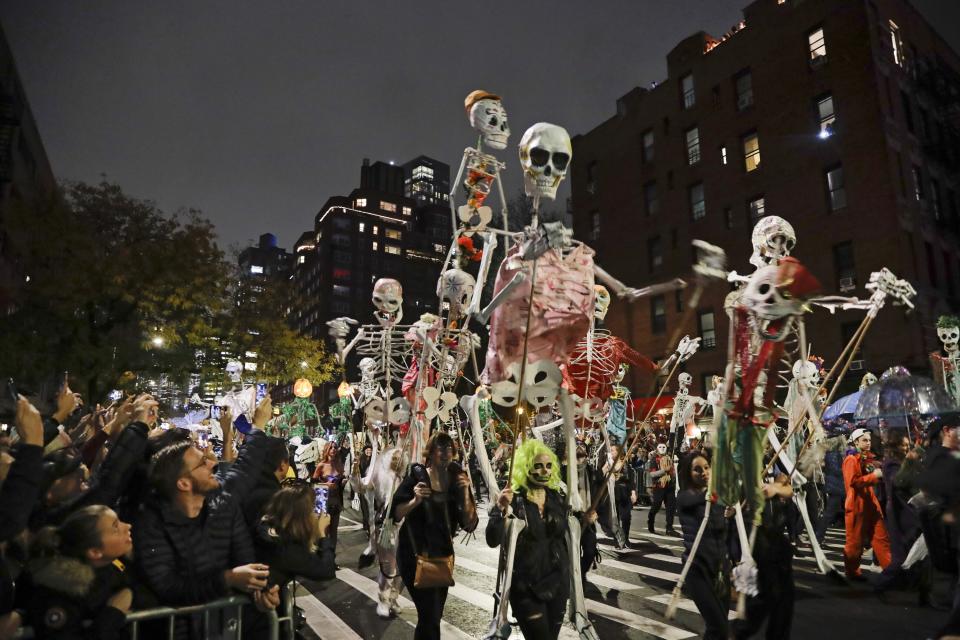 Revelers march during the Greenwich Village Halloween Parade, Thursday, Oct. 31, 2019, in New York. (AP Photo/Frank Franklin II)