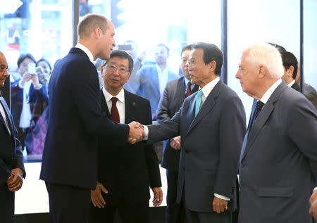 Britain's Prince William greets Japan's Deputy Prime Minister Taro Aso during the official opening of Japan House in London, Britain, September 13, 2018. Tim P. Whitby/Pool via REUTERS