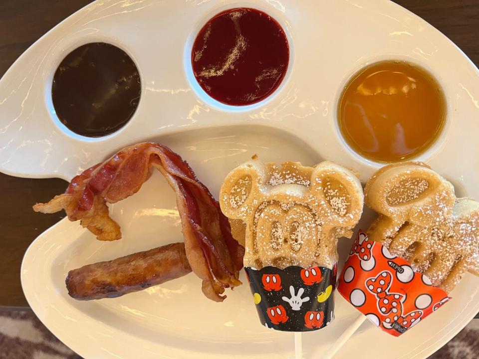 Kids can get Mickey and Minnie-shaped waffles with various dips at Topolino's Terrace – Flavors of the Riviera.