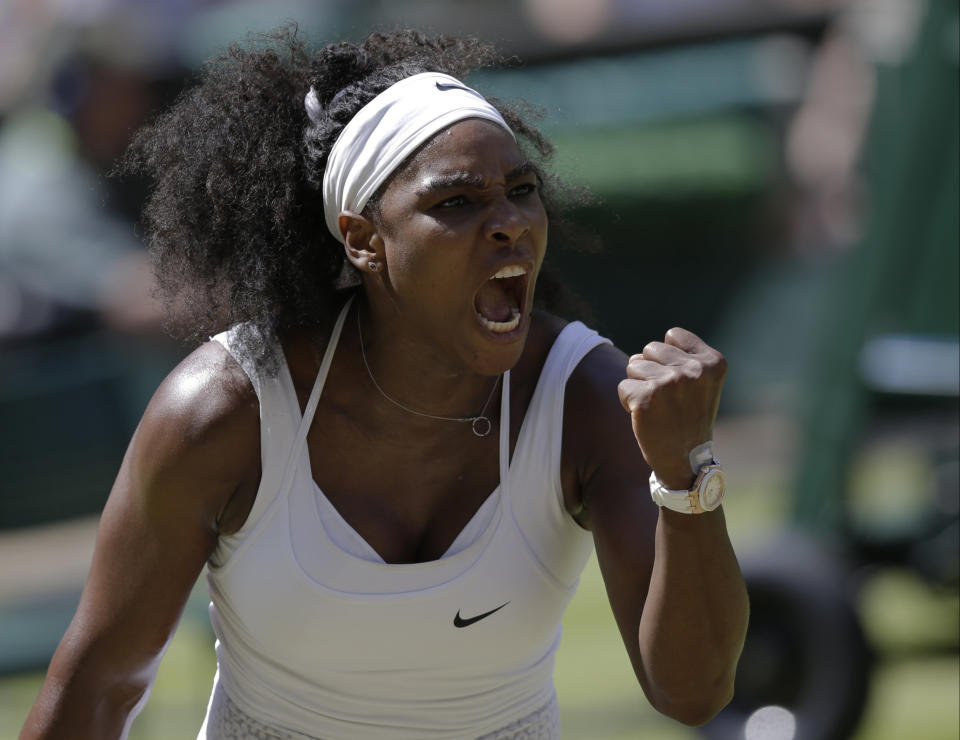 Serena Williams of the United States celebrates winning a point against Garbine Muguruza of Spain  during the women's singles final at the All England Lawn Tennis Championships in Wimbledon, London, Saturday July 11, 2015. (AP Photo/Pavel Golovkin)