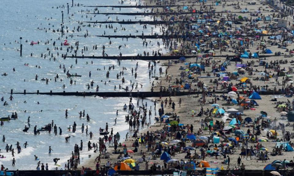 People are flocking to beaches such as Bournemouth during the heatwave.