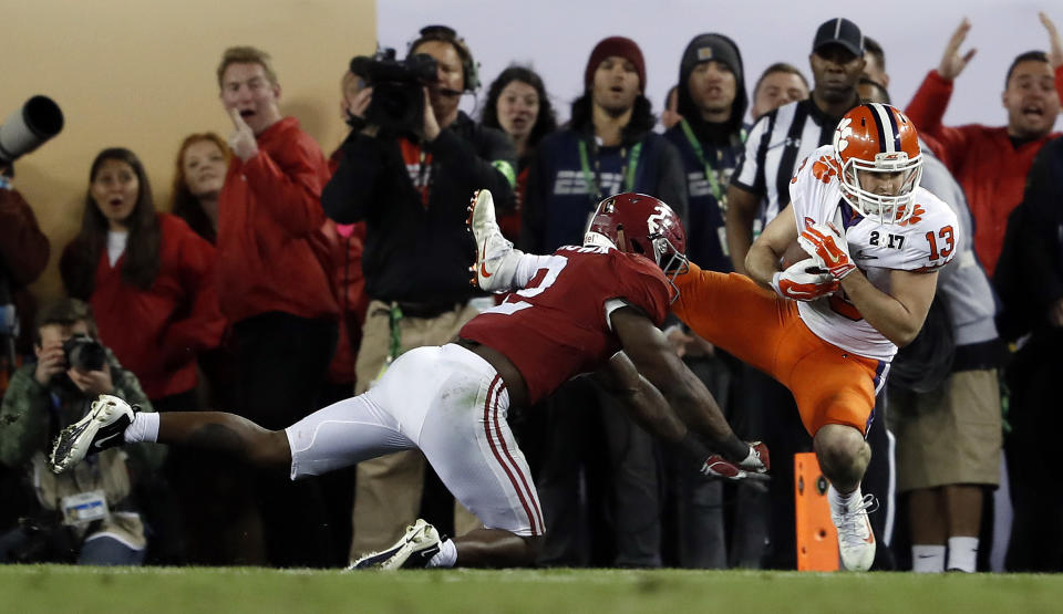 Clemson's Hunter Renfrow catches a touchdown pass in front of Alabama's Tony Brown during the second half of the NCAA college football playoff championship game Tuesday, Jan. 10, 2017, in Tampa, Fla. (AP Photo/John Bazemore)