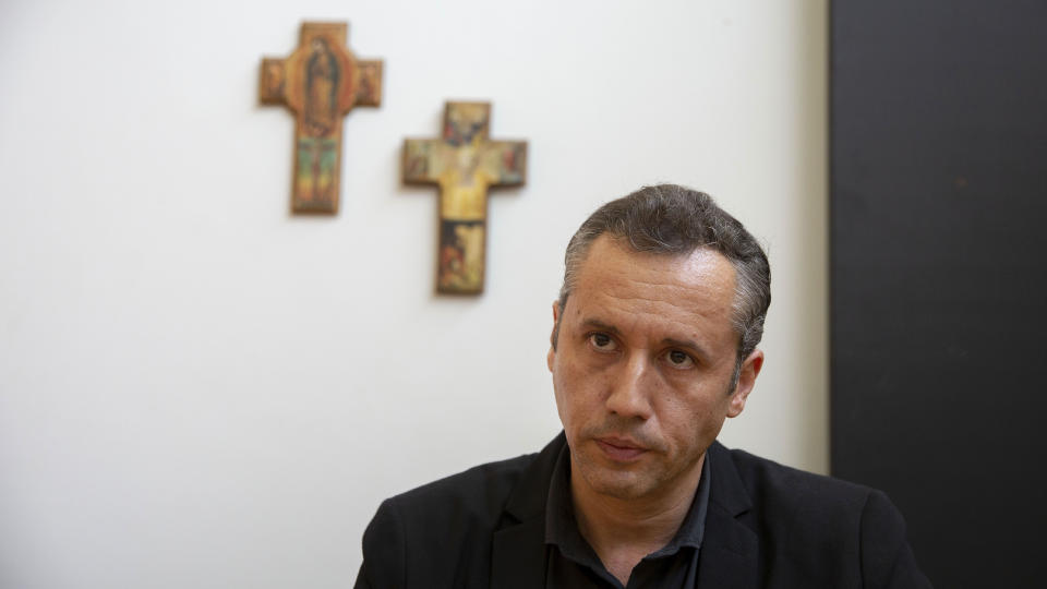 FILE - In this Oct. 25, 2019 file photo, Roberto Alvim, director of theater, dance and opera at the Brazil's National Arts Foundation, poses for pictures in Brasilia, Brazil. Brazil’s government has drawn criticism after launching a project that aims to revamp the country’s arts scene, with a focus on nationalism and religion, with Alvim being the driving force behind the initiative. (AP Photo/Eraldo Peres, File)