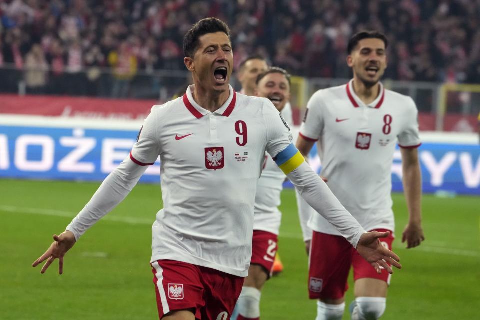 Poland's Robert Lewandowski celebrates after scoring the opening goal of his team during the World Cup 2022 playoff soccer match between Poland and Sweden at Silesian Stadium, in Chorzow, southern Poland, Tuesday, March 29, 2022. (AP Photo/Czarek Sokolowski)