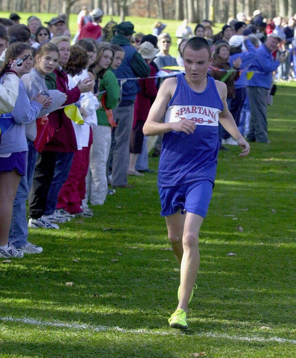 Chris Cowan of Thomas A. Edison crosses the finish line to win the boys Section 4 Class C cross country race in 2000.
