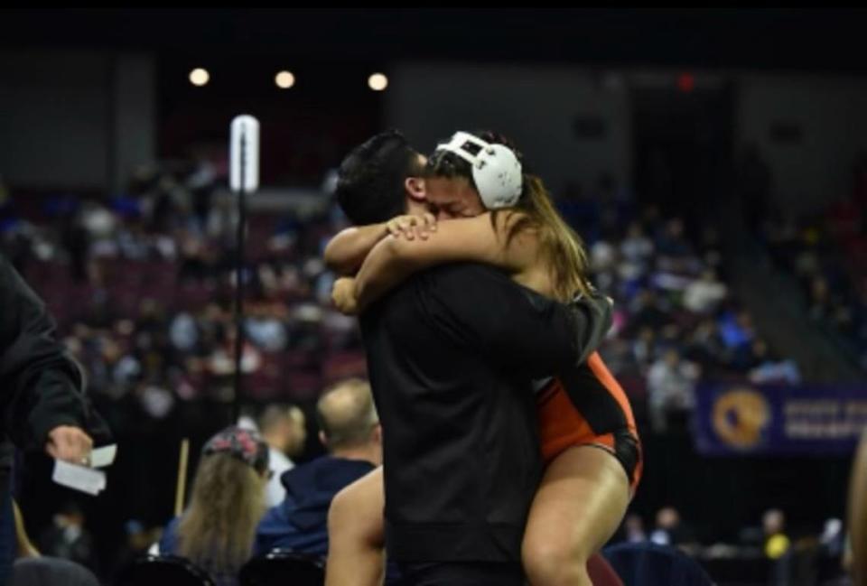 Merced High junior Evelyn Vargas celebrates after placing third at the CIF State Wrestling Meet in Bakersfield, Calif.