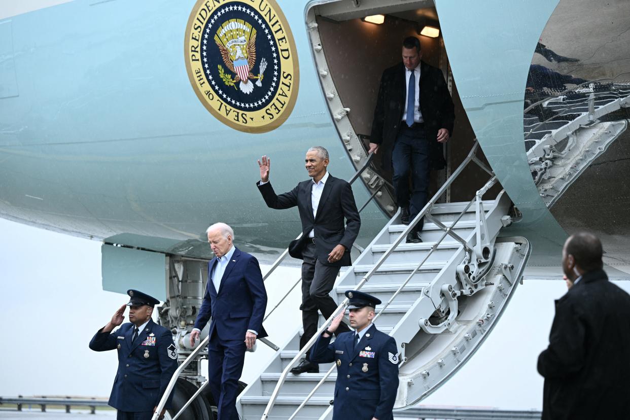 President Joe Biden and former president Barack Obama step off Air Force One upon arrival at John F. Kennedy International Airport in the Queens borough of New York City on March 28, 2024.