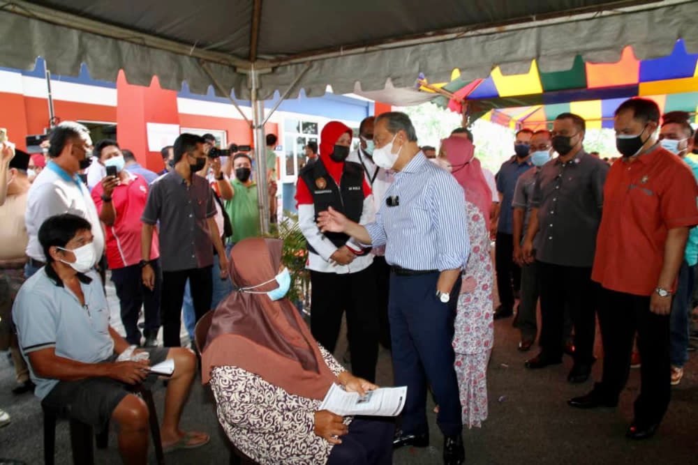 Prime Minister Tan Sri Muhyiddin Yassin during his visit to the Dewan Muafakat Bukit Gambir PPV in Johor, June 22, 2021. — Picture by Ben Tan