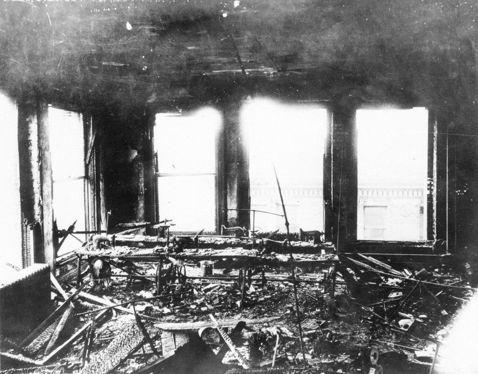 FILE - This March 1911 photo shows fire debris in a burned-out room of the Triangle Shirtwaist factory after a fire killed 146 people, mostly immigrant girls and women, when a fire started at the clothing company in New York. The victims and legacy of the 1911 Triangle Shirtwaist factory fire are being remembered with a new memorial. A structure of steel is being dedicated Wednesday, Oct. 11, 2023, at the Manhattan building where the tragedy took place. (AP Photo/File)