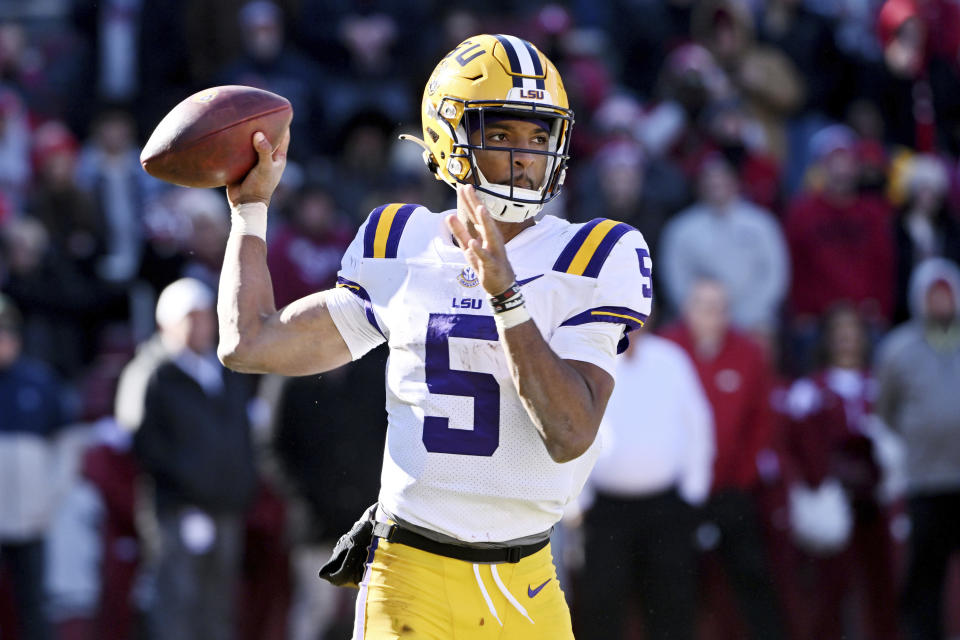 LSU quarterback Jayden Daniels (5) runs a play against Arkansas during an NCAA college football game Saturday, Nov. 12, 2022, in Fayetteville, Ark. (AP Photo/Michael Woods)