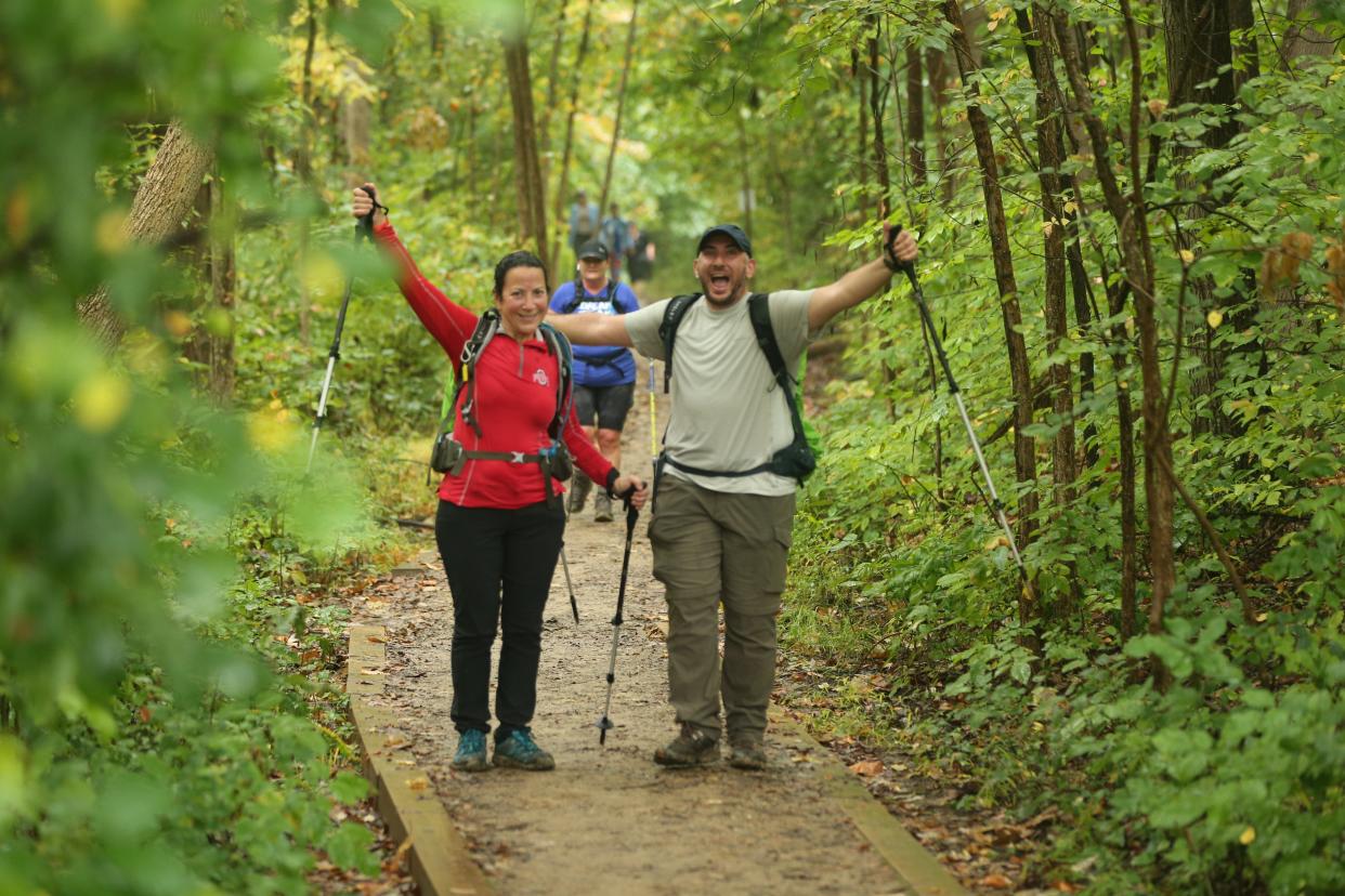 Hikers celebrate along the trail at a MammothMarch in Ohio's Cuyahoga Valley National Park in 2021.