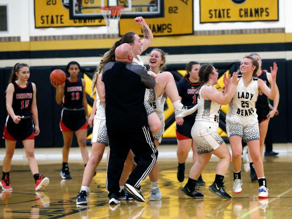 River View's Prestyn Patterson is hoisted into the air by teammates after hitting the game-winning 3-pointer as time expired in the Black Bears' 40-39 win against visiting Coshocton on Monday night at Luther Stover Gymnasium.