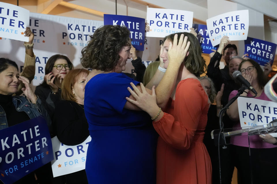 U.S. Rep. Katie Porter, D-Calif., left, a U.S. Senate candidate, embraces her daughter Betsy at an election night party, Tuesday, March 5, 2024, in Long Beach, Calif. (AP Photo/Damian Dovarganes)