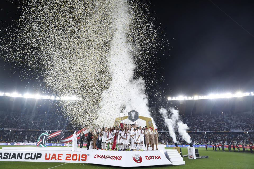 Qatar's team celebrates after winning the AFC Asian Cup final match between Japan and Qatar in Zayed Sport City in Abu Dhabi, United Arab Emirates, Friday, Feb. 1, 2019. (AP Photo/Hassan Ammar)