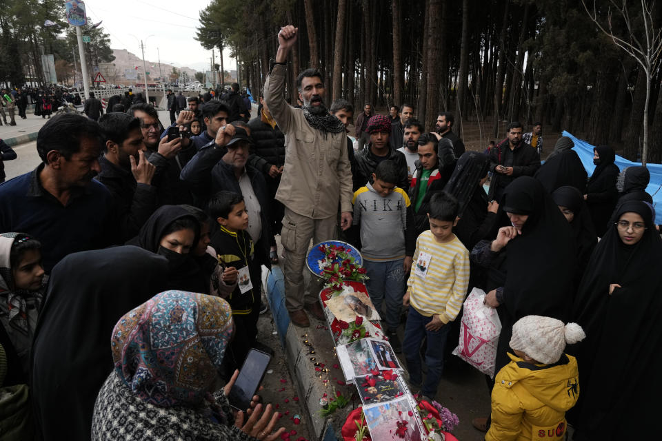 People chant slogans at the scene of Wednesday's bomb explosion in the city of Kerman, about 510 miles (820 kms) southeast of the capital Tehran, Iran, Thursday, Jan. 4, 2024. Investigators believe suicide bombers likely carried out an attack on a commemoration for an Iranian general slain in a 2020 U.S. drone strike, state media reported Thursday, as Iran grappled with its worst mass-casualty attack in decades and as the wider Mideast remains on edge. (AP Photo/Vahid Salemi)