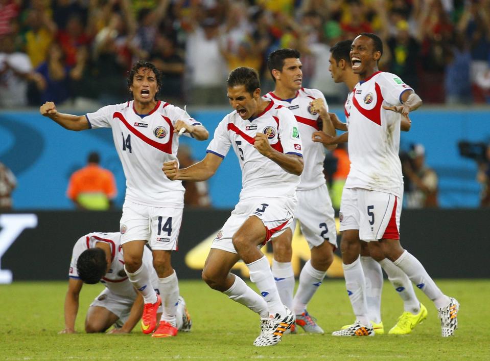 REFILE - CORRECTING CAPTION Costa Rica's players react as goalkeeper Keilor Navas makes a save against Greece's Theofanis Gekas during their penalty shootout in their 2014 World Cup round of 16 game against Greece at the Pernambuco arena in Recife June 29, 2014. REUTERS/Brian Snyder (BRAZIL - Tags: SOCCER SPORT WORLD CUP TPX IMAGES OF THE DAY)