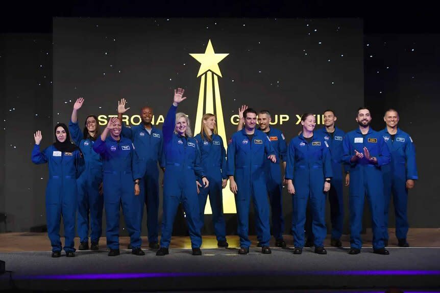 NASA's newest class of astronauts wear blue jumpsuits.