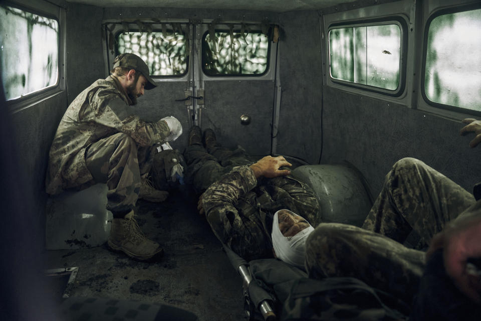 Wounded Ukrainian soldiers are seen inside a vehicle in the freed territory of the Kharkiv region, Ukraine, Monday, Sept. 12, 2022. Ukrainian troops retook a wide swath of territory from Russia on Monday, pushing all the way back to the northeastern border in some places, and claimed to have captured many Russian soldiers as part of a lightning advance that forced Moscow to make a hasty retreat. (AP Photo/Kostiantyn Liberov)