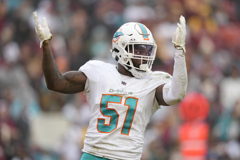 Miami Dolphins linebacker David Long Jr. (51) celebrates during the second half of an NFL football game against the Washington Commanders Sunday, Dec. 3, 2023, in Landover, Md. (AP Photo/Alex Brandon)