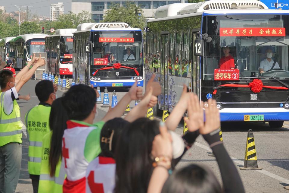 Volunteers cheer for gaokao candidates in Yantai, Shandong province, China, June 7, 2023. The 2023 National college entrance examination, or gaokao, officially kicked off on Tuesday, with 12.91 million students expected to go to the exam halls across the country, a record high.