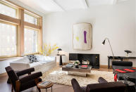 <p>The sleek living room is perfect for entertaining guests. Like, say, your twin sister. </p>