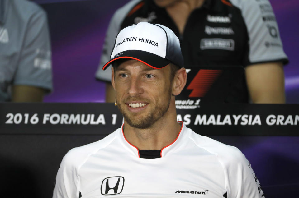 McLaren driver Jenson Button of Britain smiles during a drivers press conference before the Malaysian Formula One Grand Prix at the Sepang International Circuit in Sepang, Malaysia, Thursday, Sept. 29, 2016. (AP Photo/Vincent Thian)