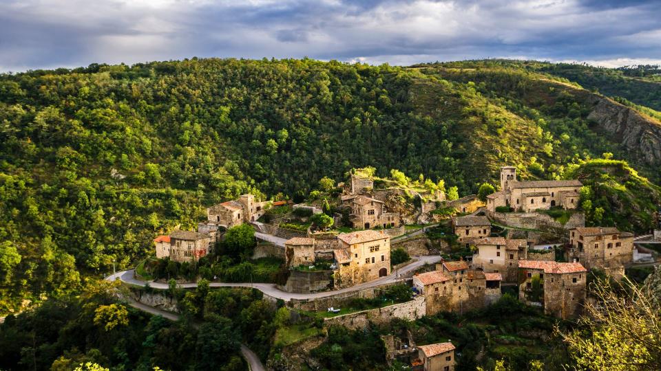 green hills and small village in Rhône Valley, France