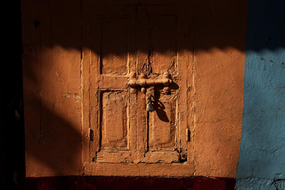 A shop is seen locked at a market area in Gauhati, India on June 18, 2021. Rows of locked shops confront bargain-hunters for most of the day in Fancy Bazar, a nearly 200-year-old market that offered cheap prices until the COVID-19 pandemic hit Gauhati, the biggest city in India’s remote northeast. (AP Photo/Anupam Nath)