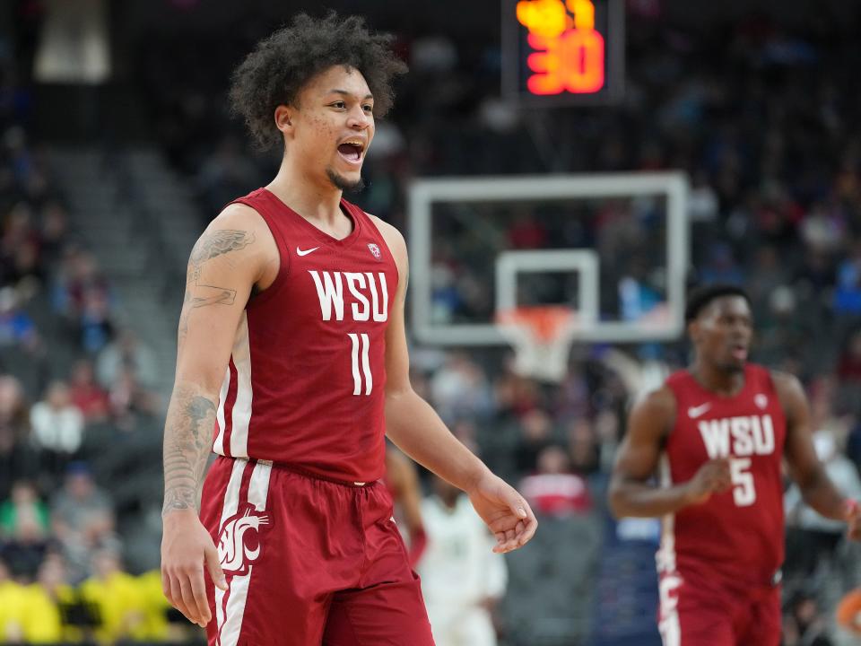 Washington State Cougars forward DJ Rodman (11) celebrates after a scoring play against the Oregon Ducks during the first half at T-Mobile Arena.