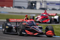 Will Power of Australia drives through a turn during practice for the IndyCar auto race at Indianapolis Motor Speedway in Indianapolis, Friday, May 14, 2021. (AP Photo/Michael Conroy)