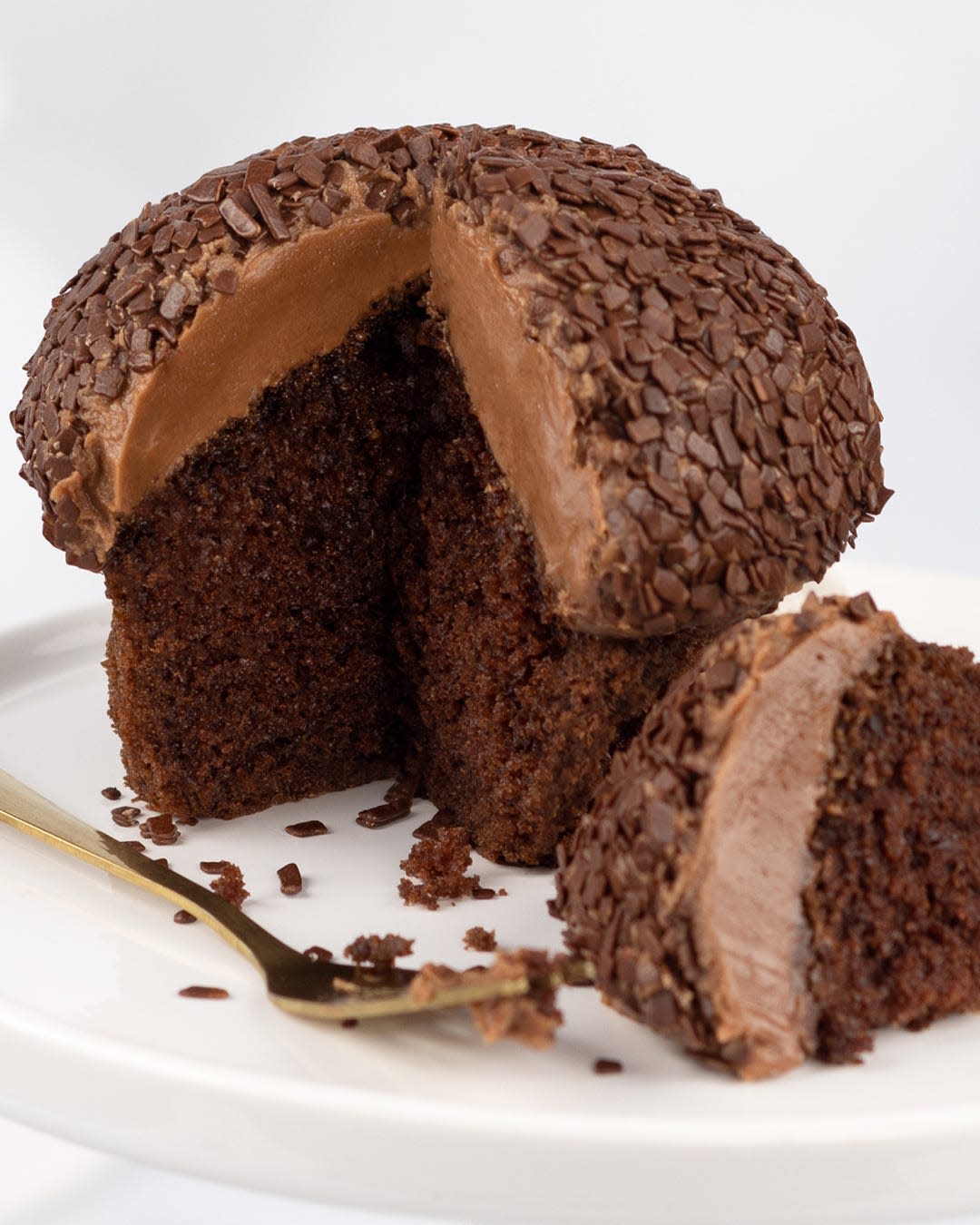 This Belgian dark chocolate cake from Sprinkles Cupcakes is made with rich cocoa and Madagascar Bourbon Vanilla, topped with a bittersweet chocolate frosting and chocolate paillettes.