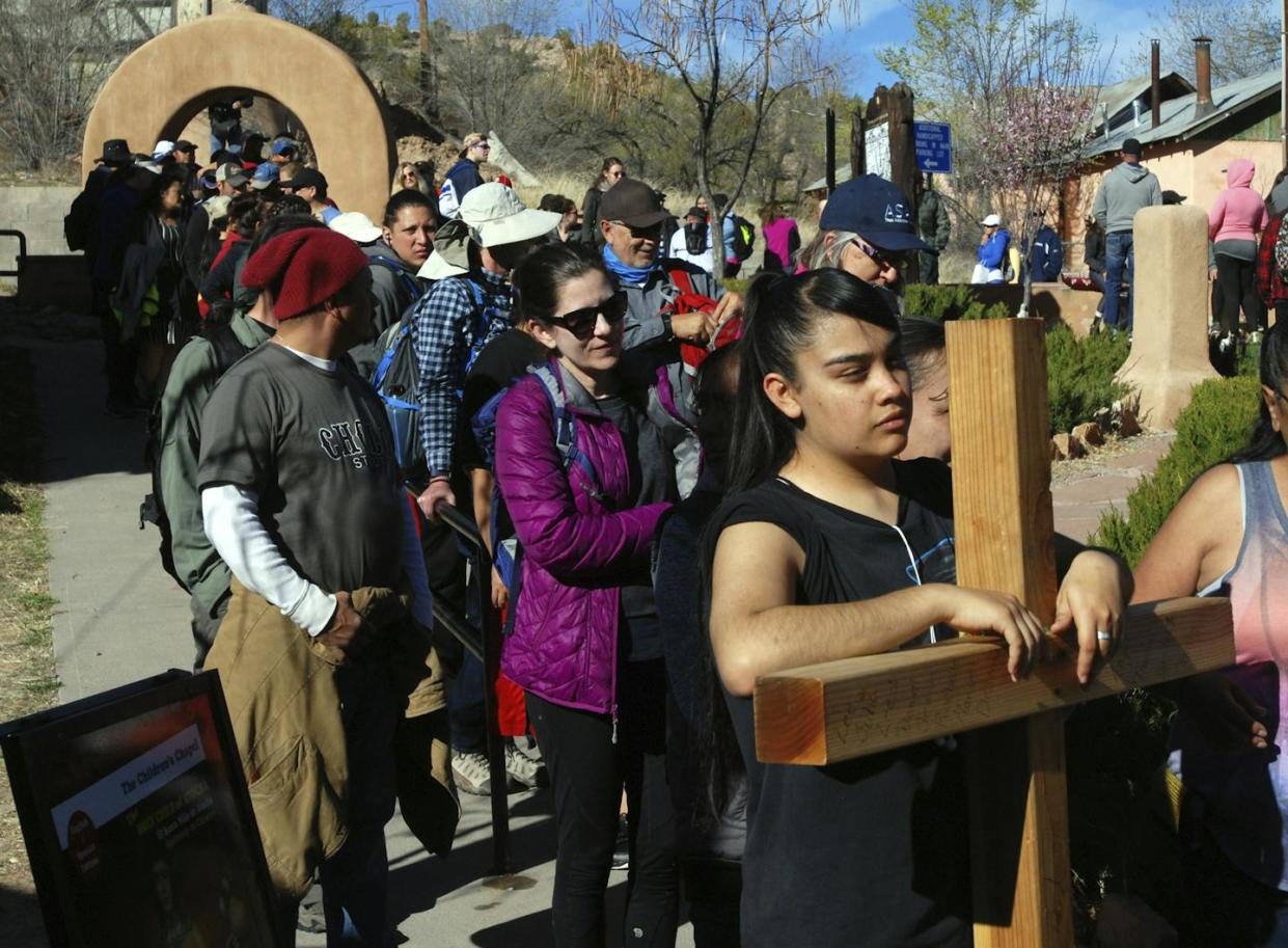 Thousands of Catholics travel by foot to Santuario de Chimayo, in northern New Mexico, during an annual Good Friday pilgrimage. <a href="https://newsroom.ap.org/detail/CatholicPilgrimageNewMexico/27b7d518d220496e8911f7b0c20bf07d/photo?Query=Chimay%C3%B3%20New%20Mexico%20pilgrimage&mediaType=photo&sortBy=&dateRange=Anytime&totalCount=14&currentItemNo=3" rel="nofollow noopener" target="_blank" data-ylk="slk:AP Photo/Morgan Lee;elm:context_link;itc:0;sec:content-canvas" class="link ">AP Photo/Morgan Lee</a>