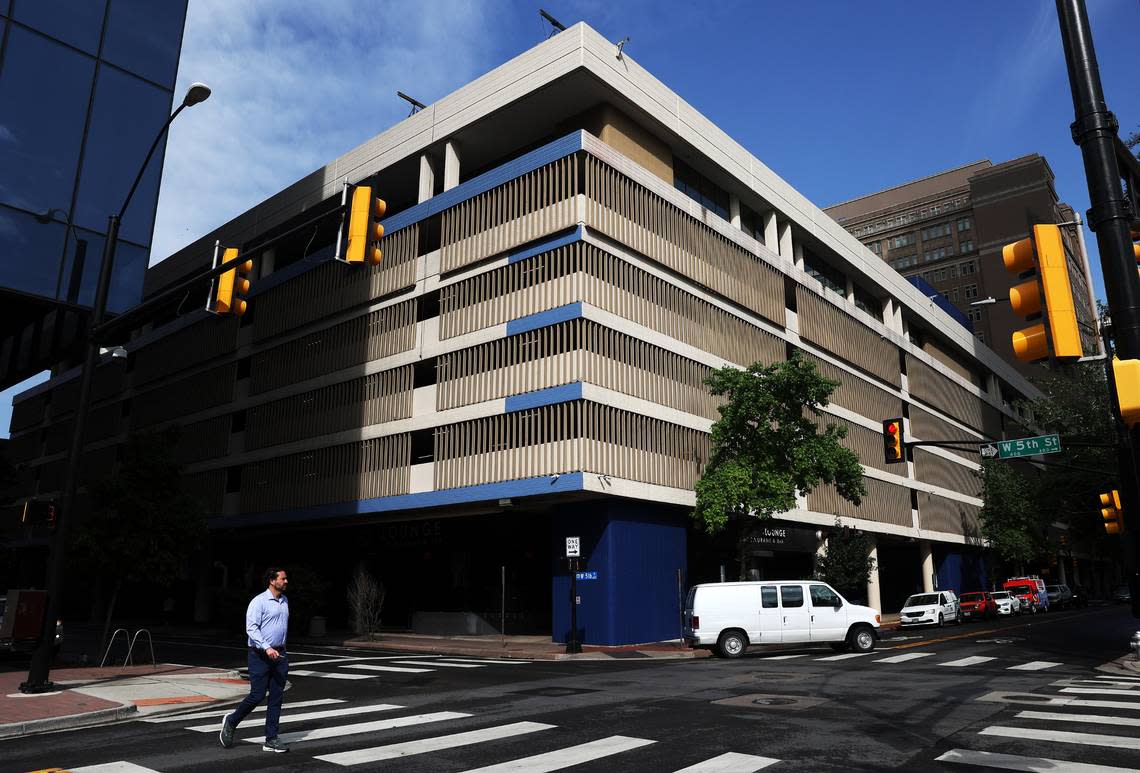 A pedestrian crosses Taylor Street on Tuesday, April 16, 2024, in downtown Fort Worth. Dickies relocated its headquarters last summer from West Vickery Boulevard to The Tower complex in the heart of town in downtown​. Amanda McCoy/amccoy@star-telegram.com