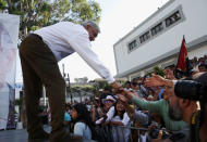 Leftist front-runner Andres Manuel Lopez Obrador of the National Regeneration Movement (MORENA) shakes hands with supporters during his campaign rally in Milpa Alta, Mexico, April 20, 2018. REUTERS/Henry Romero