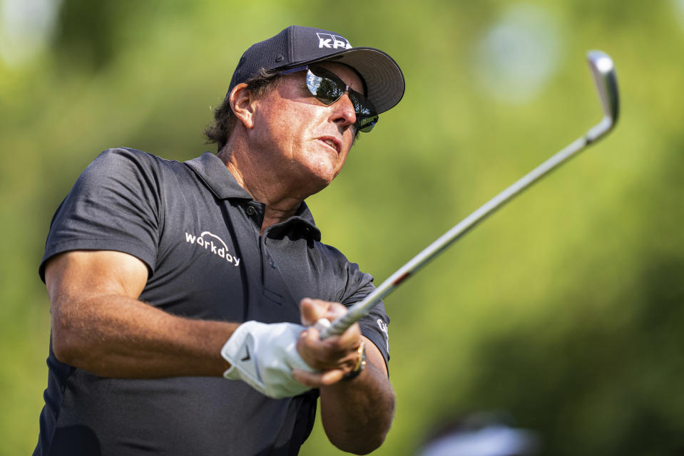 Phil Mickelson watches his tee shot on the sixth hole during the first round of the Wells Fargo Championship golf tournament at Quail Hollow on Thursday, May 6, 2021, in Charlotte, N.C. (AP Photo/Jacob Kupferman)