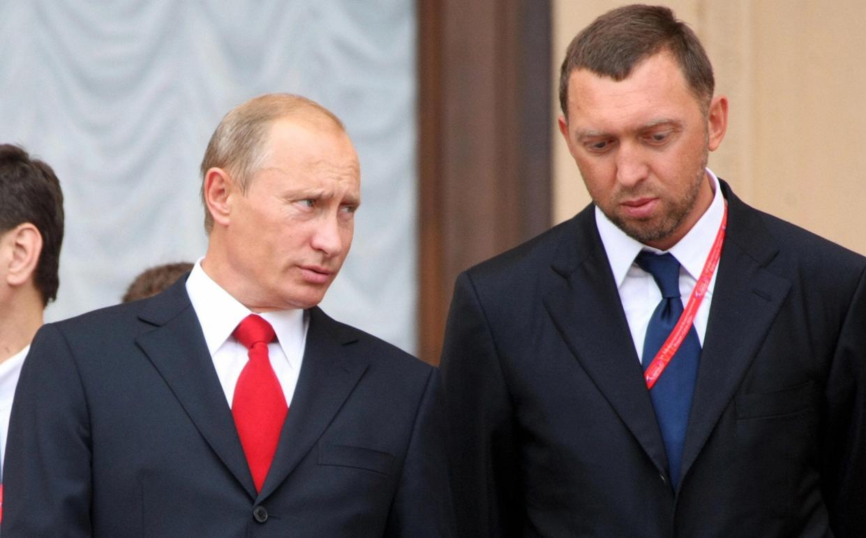 Vladimir Putin and Oleg Deripaska - ILIA PITALEV/AFP via Getty Images