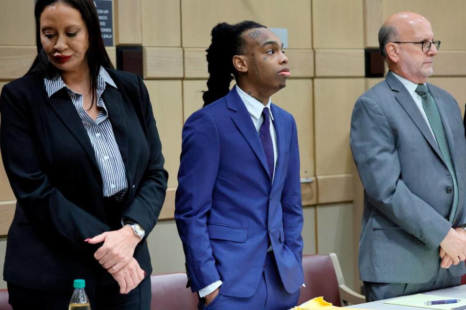 Jamell Demons, better known as rapper YNW Melly, stands with his attorneys,Raven Ramona Liberty, left, and Stuart Adelstein, as jurors enter the courtroom for closing arguments in his trial at the Broward County Courthouse in Fort Lauderdale on Thursday, July 20, 2023. Demons, 22, is accused of killing two fellow rappers and conspiring to make it look like a drive-by shooting in October 2018. (Amy Beth Bennett / South Florida Sun Sentinel)