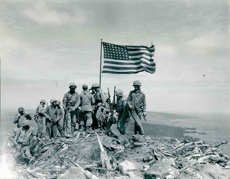 U.S. Marines raise the American flag atop Mount Suribachi on Iwo Jima