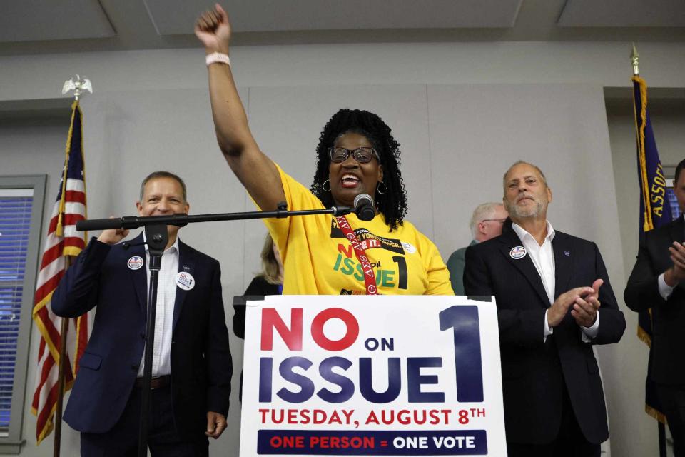 <p>Jay LaPrete/AP photo</p> Deidra Reese, statewide program manager for the Ohio Unity Coalition, celebrates the defeat of Issue 1 during a watch party in Columbus on Aug. 8, 2023