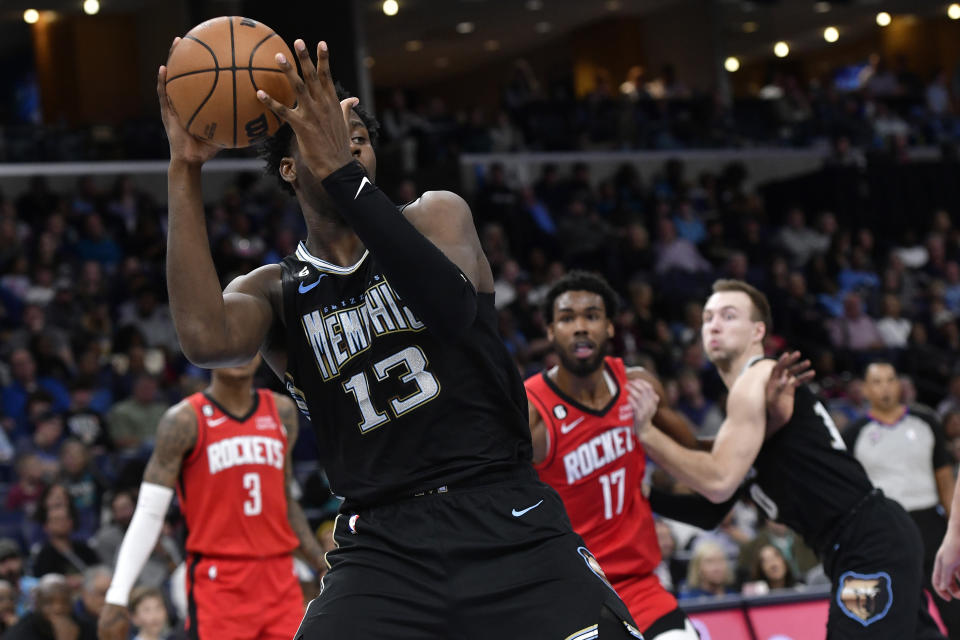 Memphis Grizzlies forward Jaren Jackson Jr. (13) handles the ball against the Houston Rockets in the first half of an NBA basketball game Friday, March 24, 2023, in Memphis, Tenn. (AP Photo/Brandon Dill)