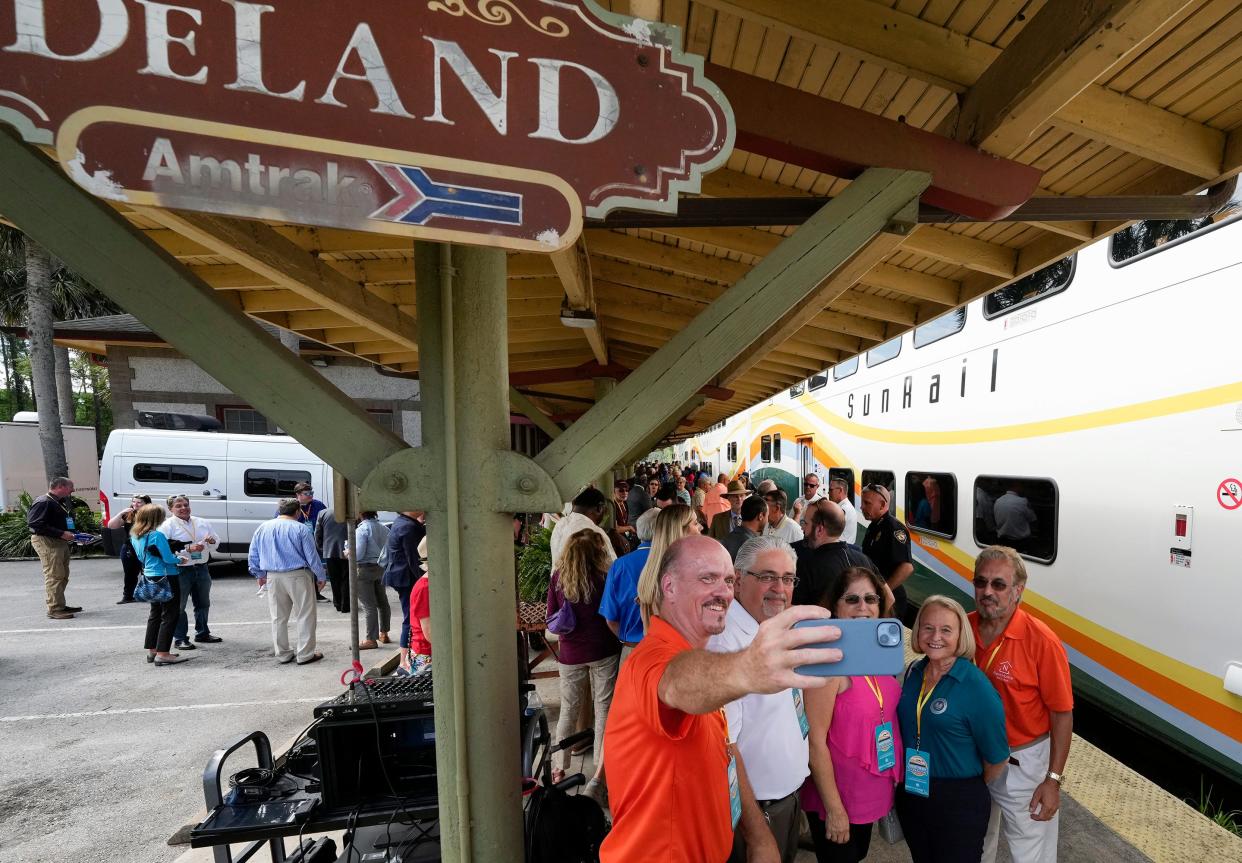 Guests board the SunRail train during a groundbreaking ceremony for the new SunRail expansion station in DeLand, Monday, May 22, 2023. 