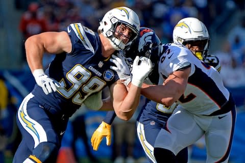 Los Angeles Chargers defensive end Joey Bosa (99) works against Denver Broncos tight end Jeff Heuerman (82) during the first quarter at StubHub Center - Credit: Jake Roth/USA TODAY