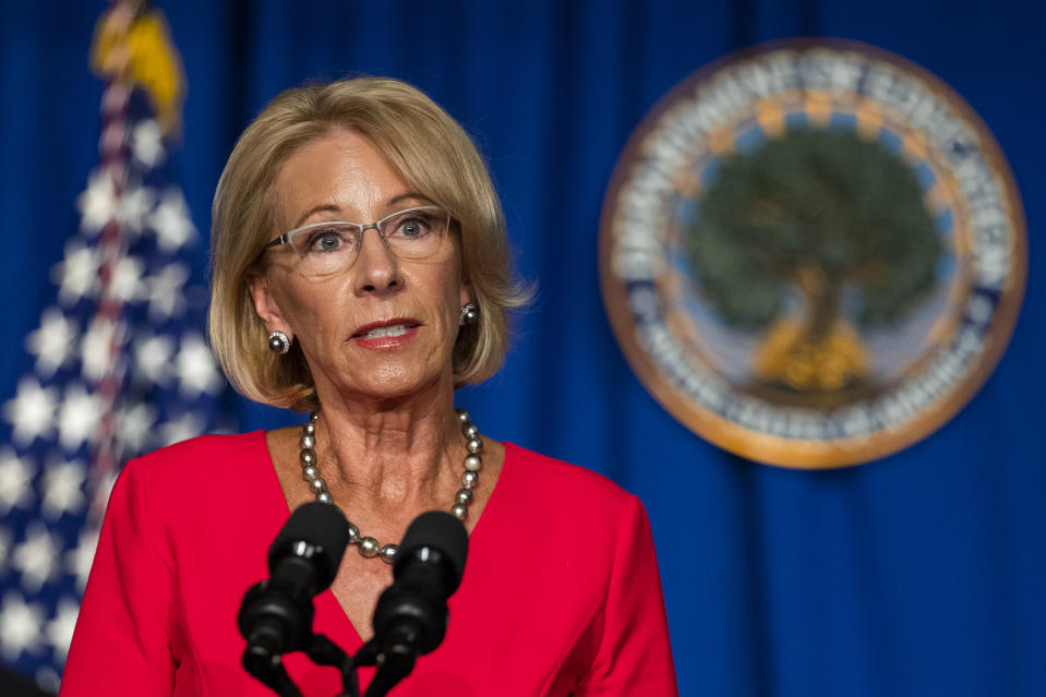 FILE - In this July 8, 2020, file photo, Education Secretary Betsy DeVos speaks during a briefing at the Department of Education building in Washington. On Friday, July 17, 2020, The Associated Press reported on stories circulating online incorrectly asserting that DeVos said that “only 0.02%” of children will die when returning to school during the pandemic. A spokeswoman with the U.S. Department of Education confirmed to the AP that the statement was falsely attributed to DeVos, who supports the reopening of schools and the return of children to classrooms. (AP Photo/Manuel Balce Ceneta, File)