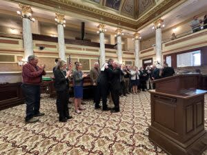 Sen. Mike Lang, R-Malta, hugs lawmakers of both parties who came to a press conference on Monday, April 1, 2023, to show their support for his Senate Bill 442.