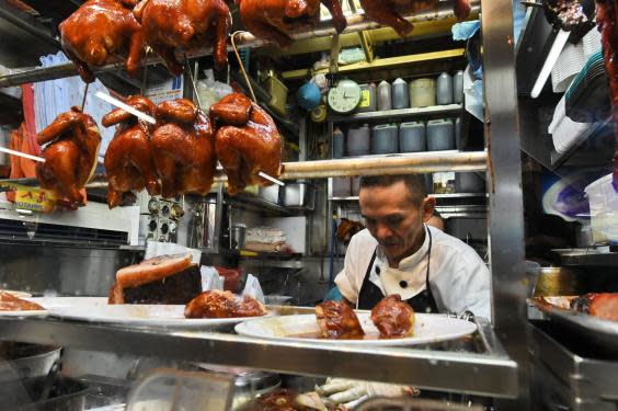 Street hawker Chan Hon Meng has been awarded a Michelin star for his stall (Getty)