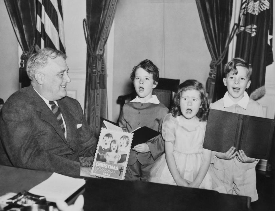 Children sing Christmas carols with FDR in 1940.