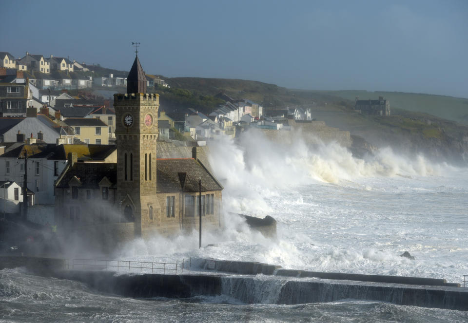 Waves break around the church in the harbour at Porthleven, Cornwall, as Hurricane Ophelia hits the UK and Ireland with gusts of up to 80mph.&nbsp;